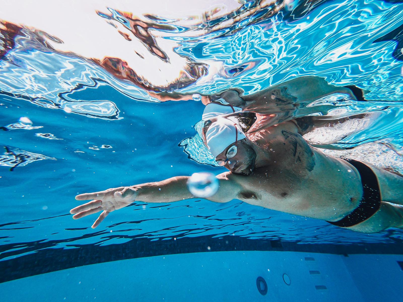 Participant swims in a pool.