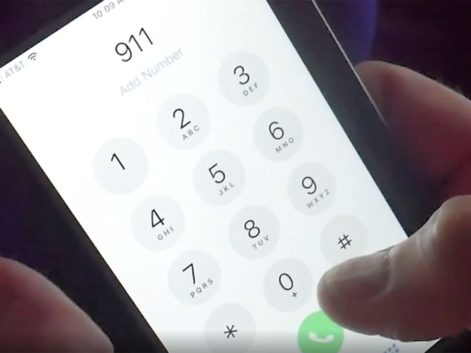 Image of a phone with 911 in the add number section