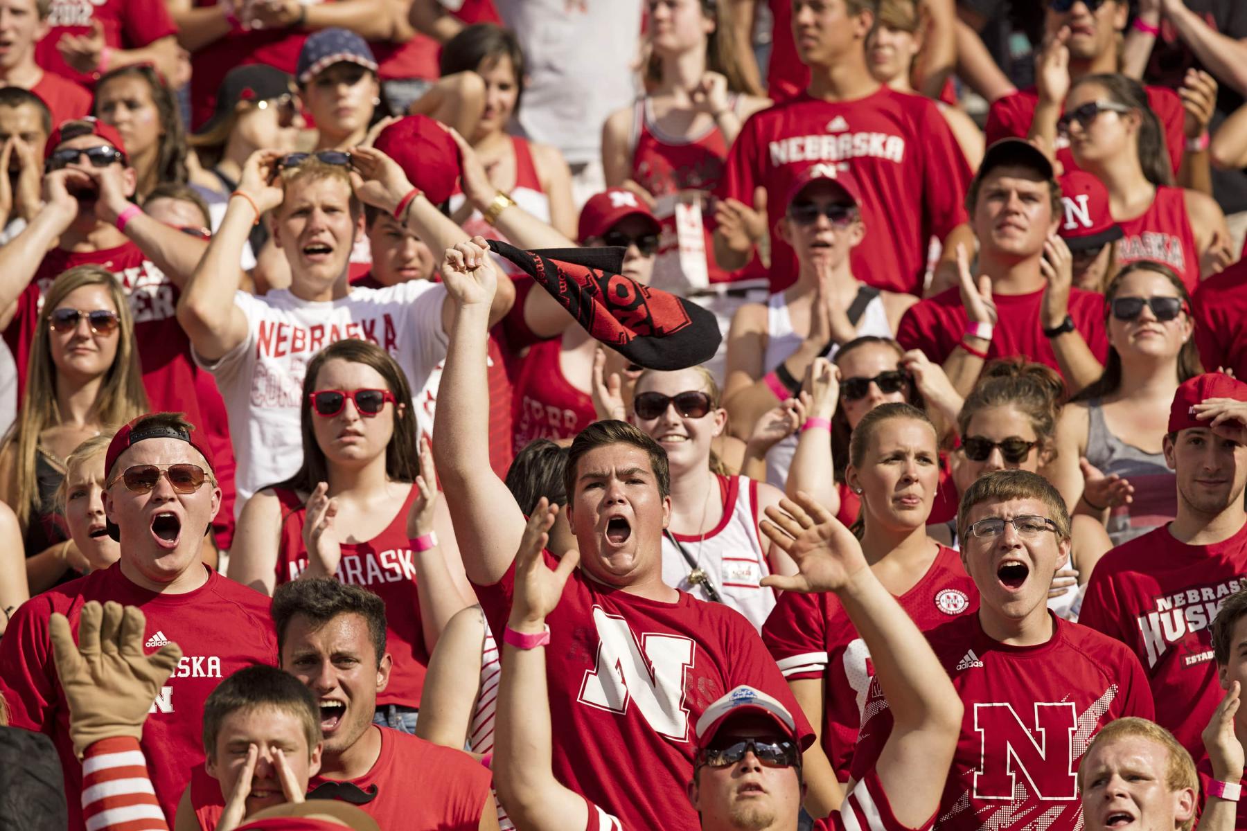 Students cheer during a Nebraska football game