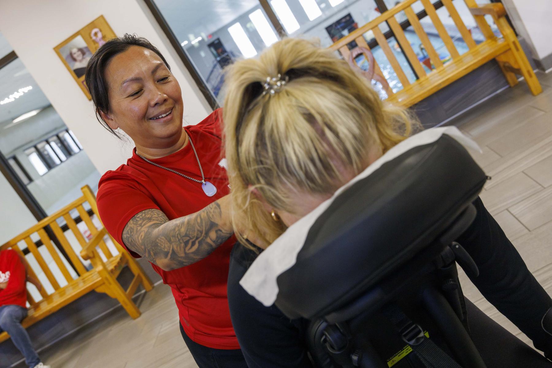Massage therapist gives a chair massage in the Campus Recreation Center.