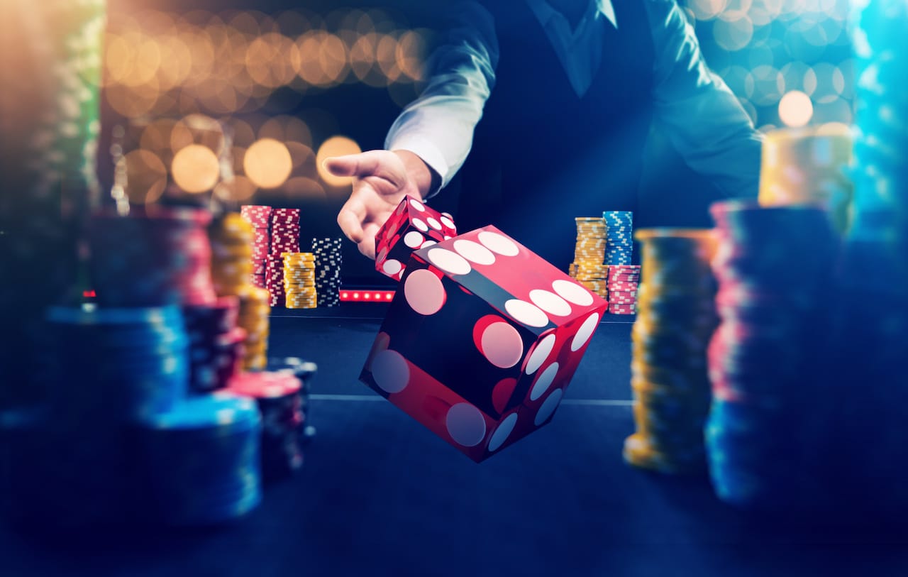 Throwing dice in between poker chips