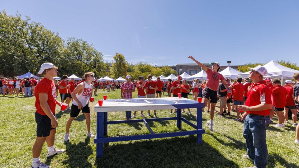 Students play games during a Husker Tailgate in the green space of the Nebraska Union