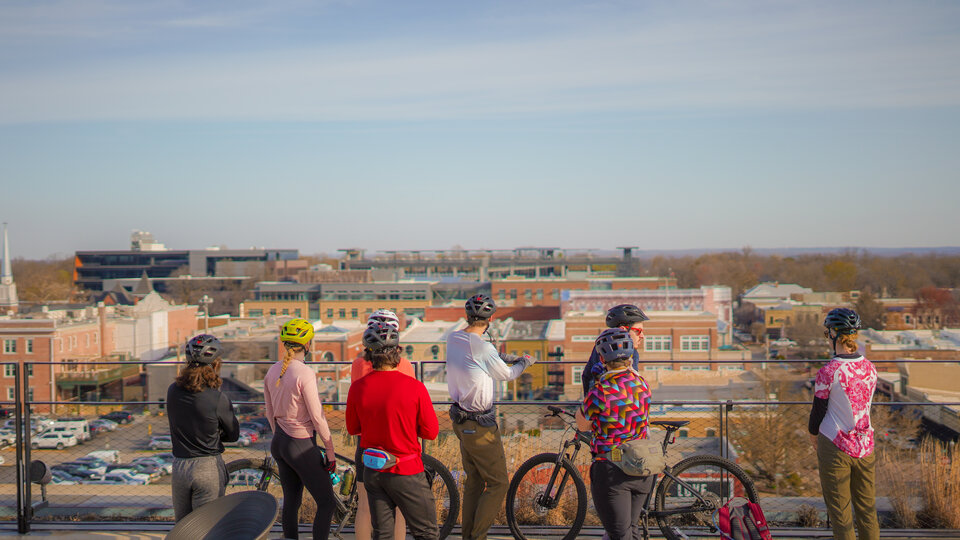 group of bicycle riders overlooking view