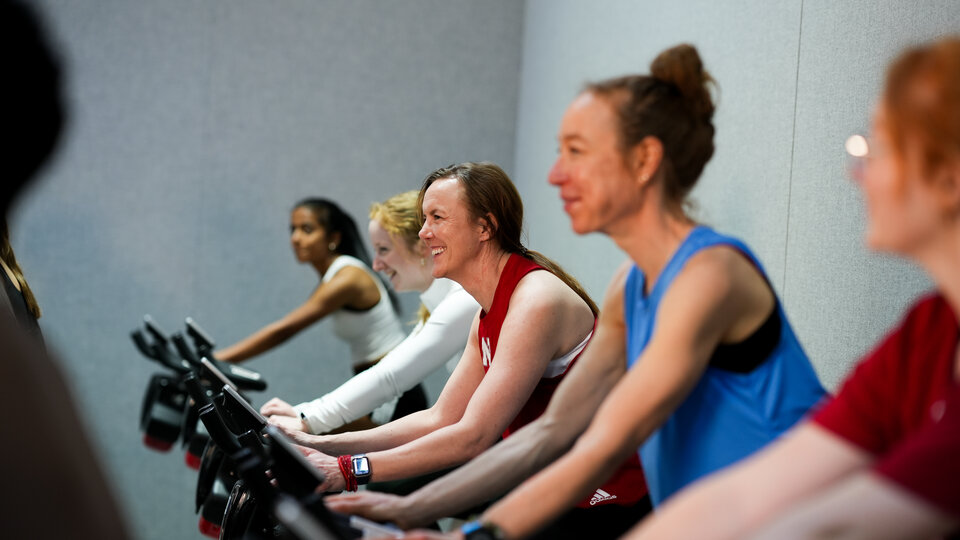 group of people in a cycling class.