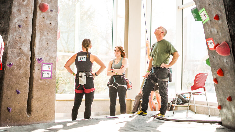 group of people at the climbing wall