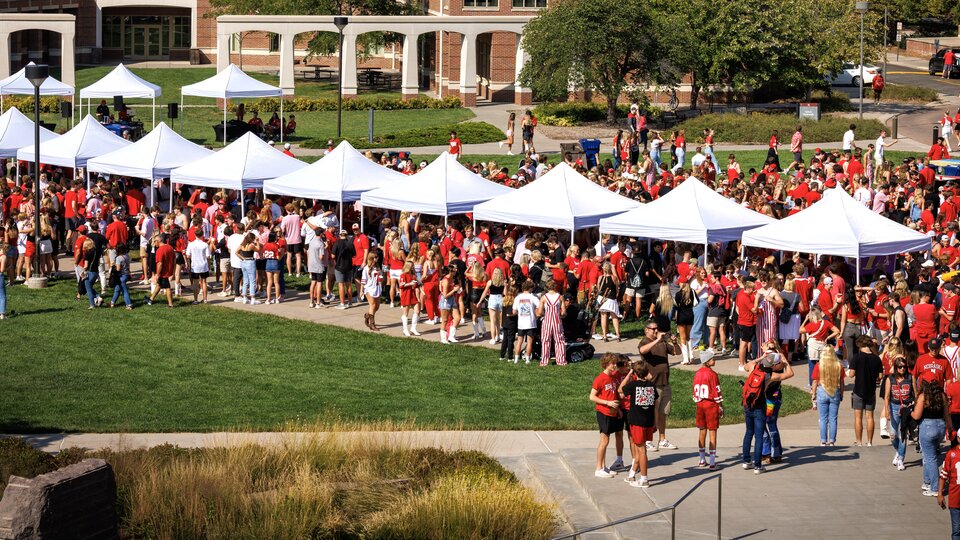 Students play games during a Husker Tailgate in the green space of the Nebraska Union