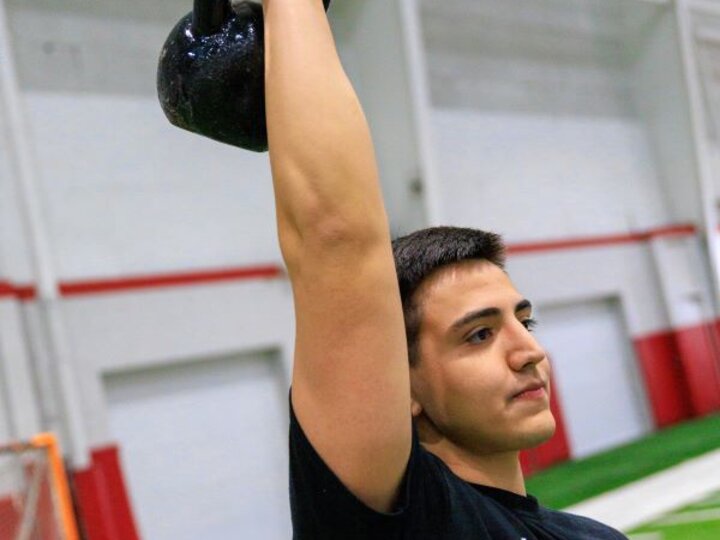 person lifting a dumbell