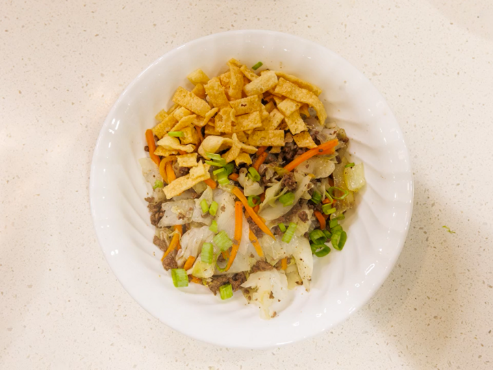 Egg roll skillet is shown from the top, served in a white bowl