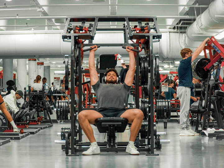Student lifting weights