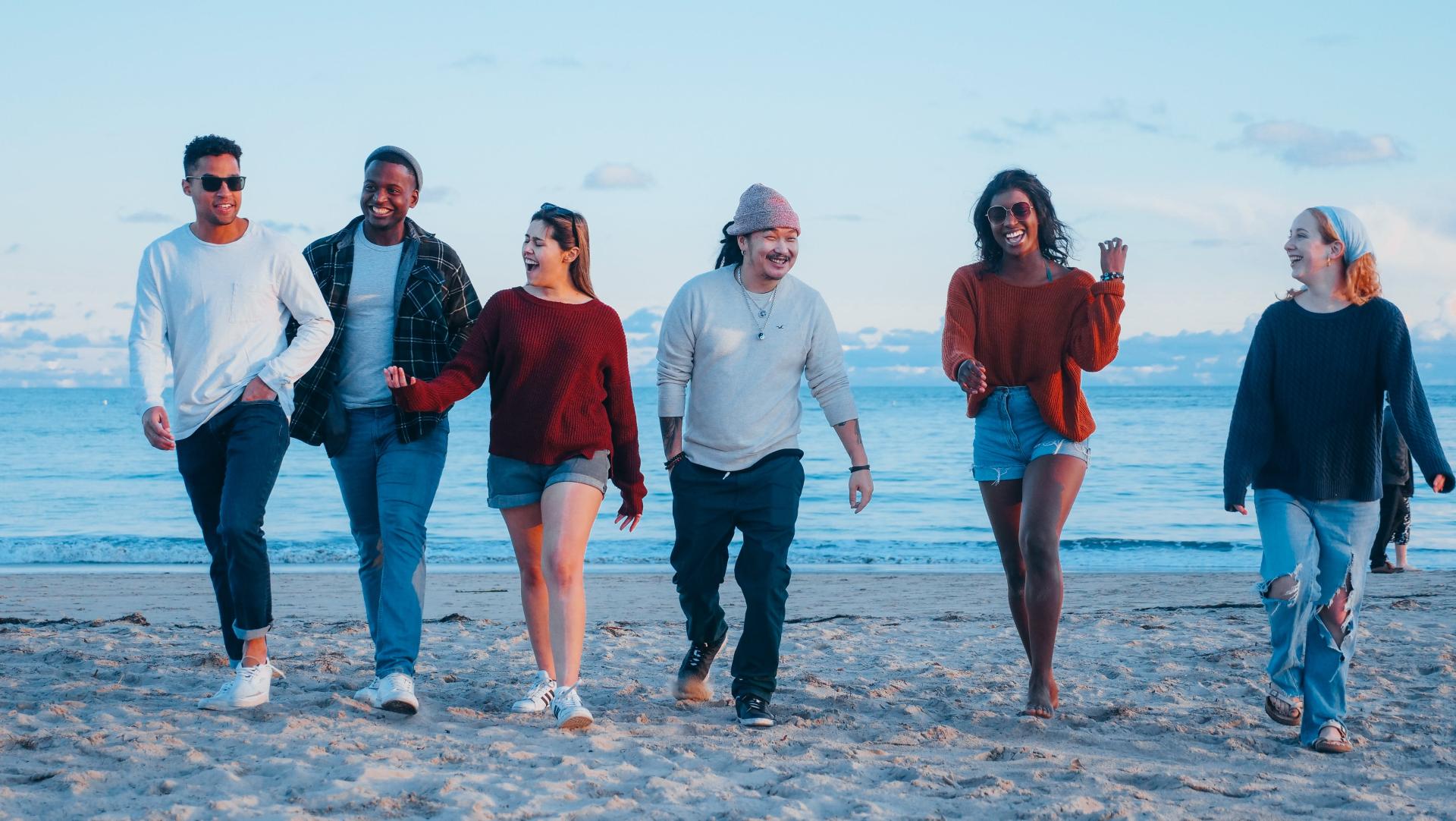 People walk on a beach