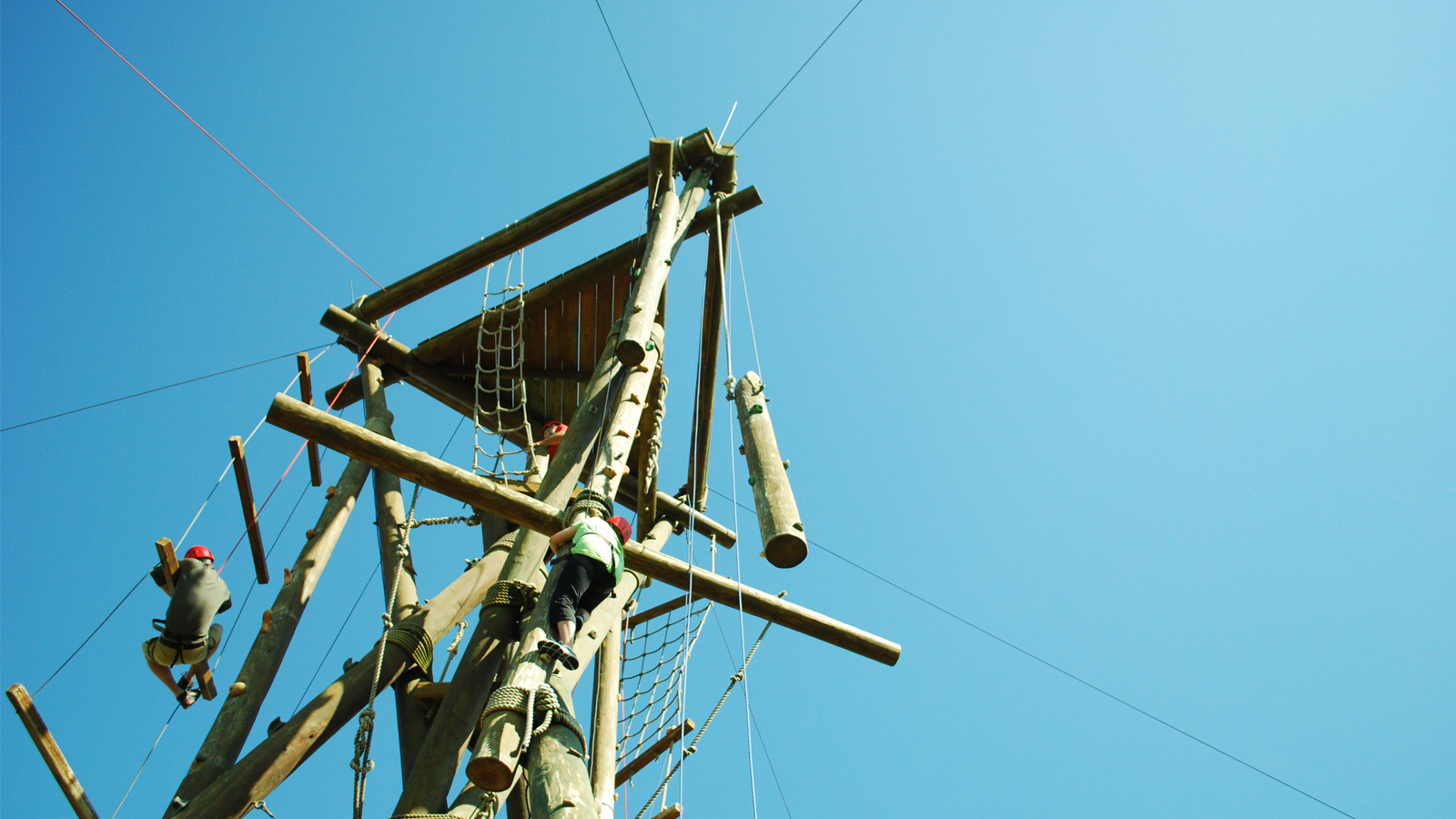 Individuals participate on the alpine tower at the Leadership Training Center.