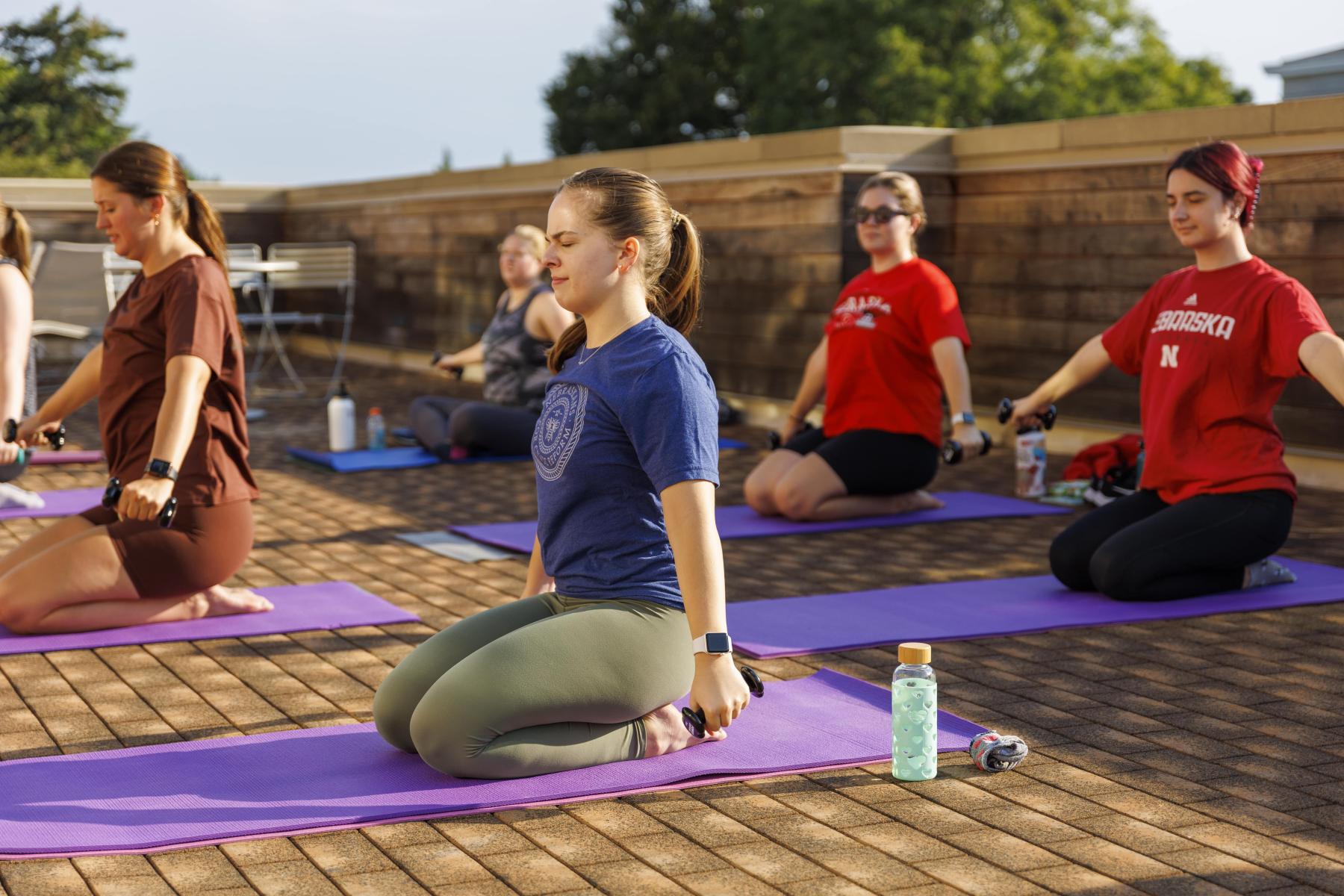 Participants enjoy a barre class on the RWC rooftop patio.