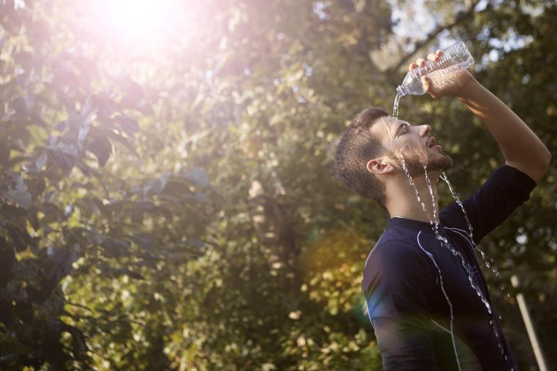 Person pours water over their face