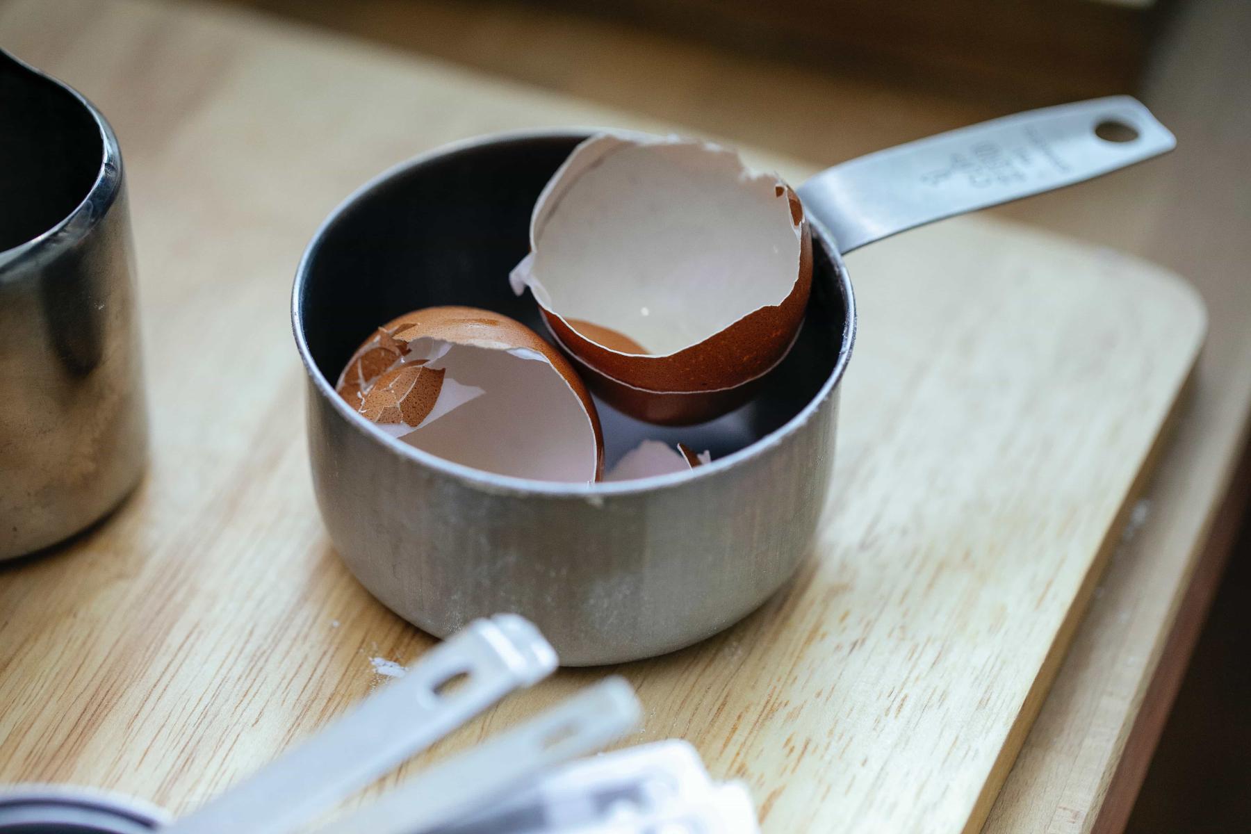 Egg shells in a pot on the counter